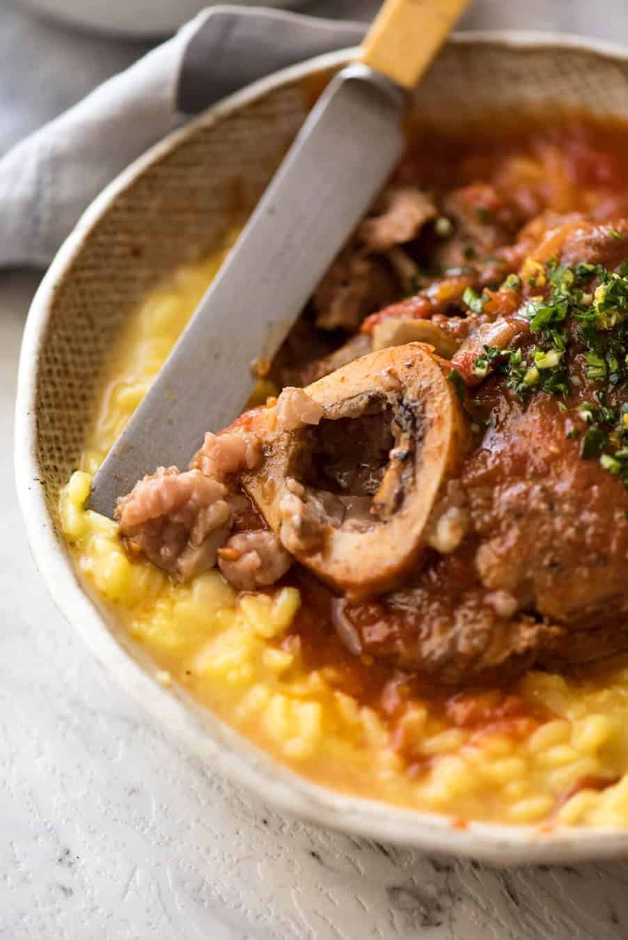 Fork tender veal braised in a rich red sauce, Osso Buco is a meal fit for a king! dev.recipetineats.com