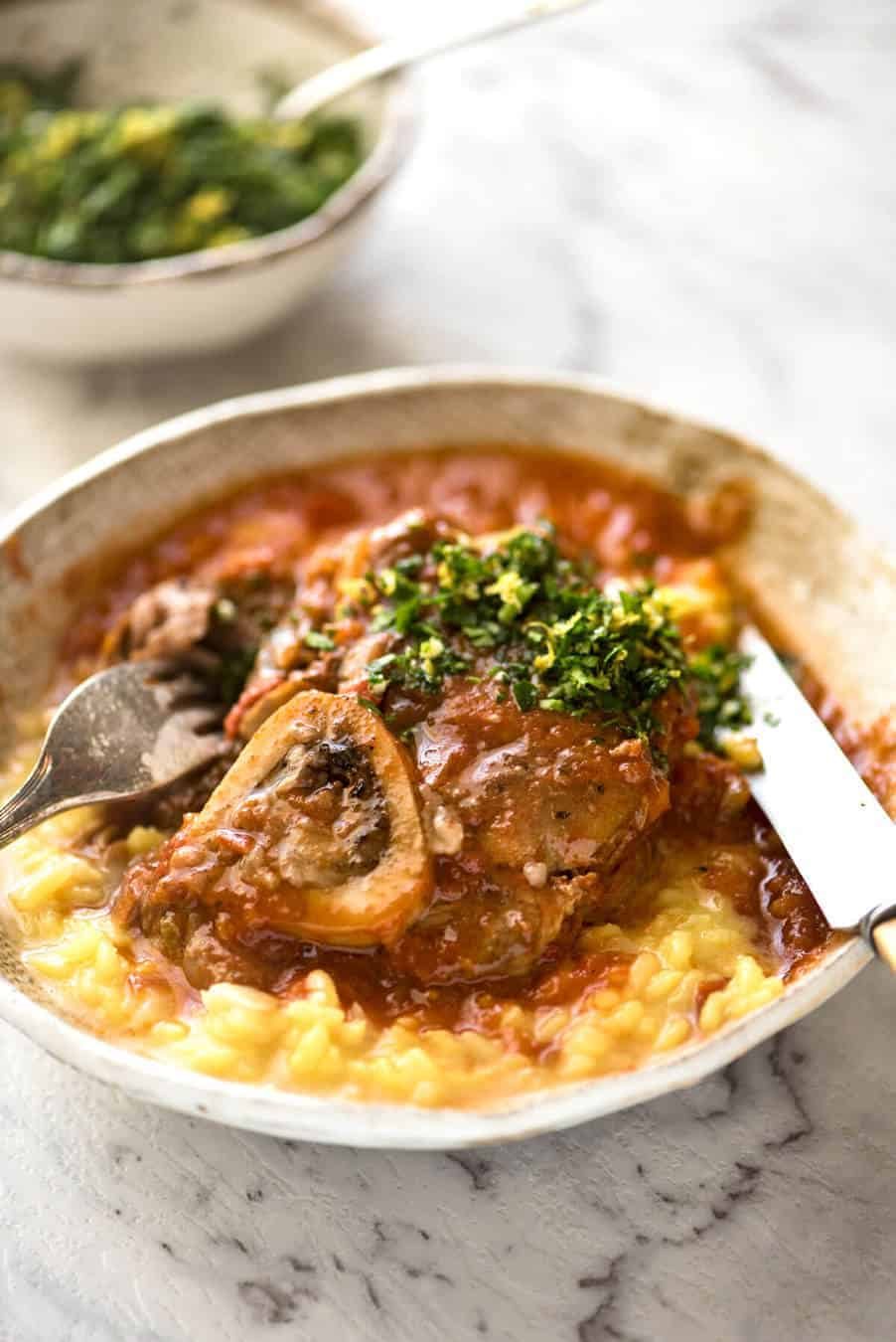 Fork tender veal braised in a rich red sauce, Osso Buco is a meal fit for a king! dev.recipetineats.com