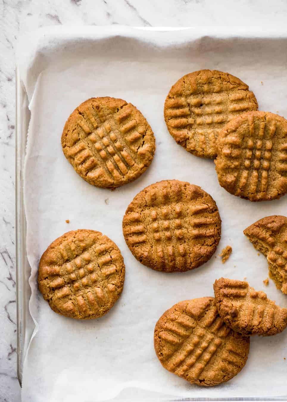The World's Best Easy Peanut Butter Cookies are SOFT and CHEWY. Peanut butter, brown sugar and egg is all you need! dev.recipetineats.com