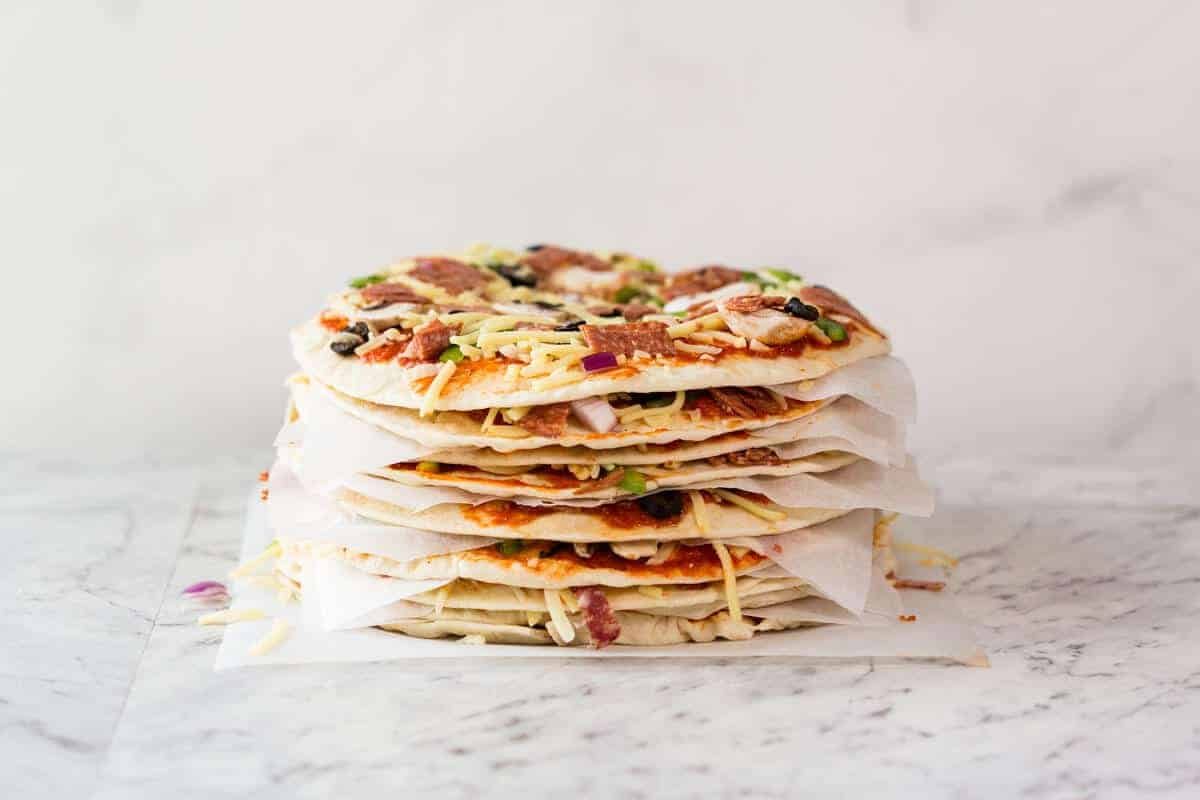 $2 Homemade Frozen Pizzas - quick and easy made using flatbreads, cook from frozen for a terrific Thin & Crispy pizza! dev.recipetineats.com