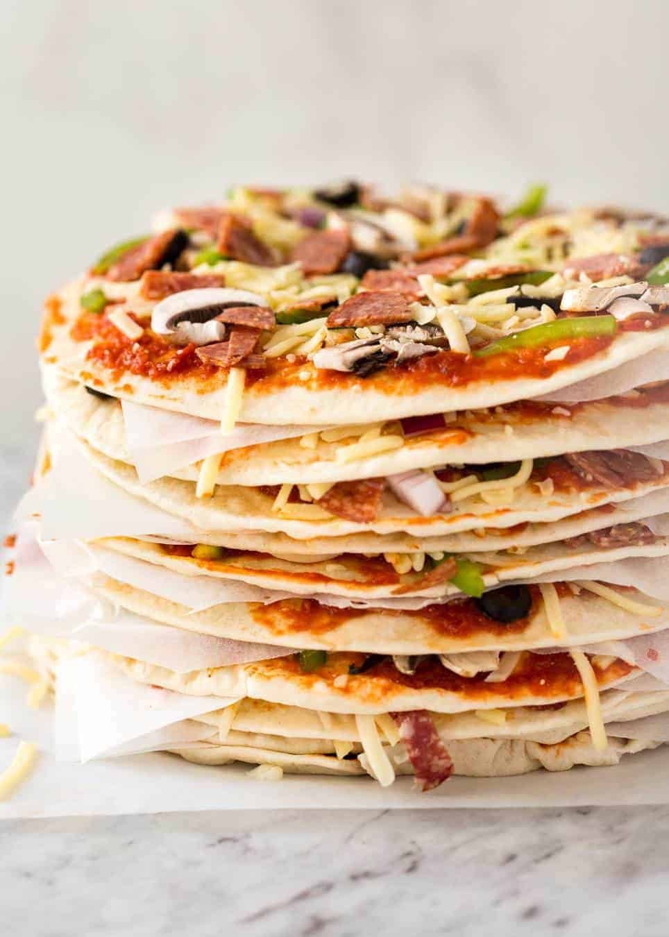 $2 Homemade Frozen Pizzas - quick and easy made using flatbreads, cook from frozen for a terrific Thin & Crispy pizza! dev.recipetineats.com