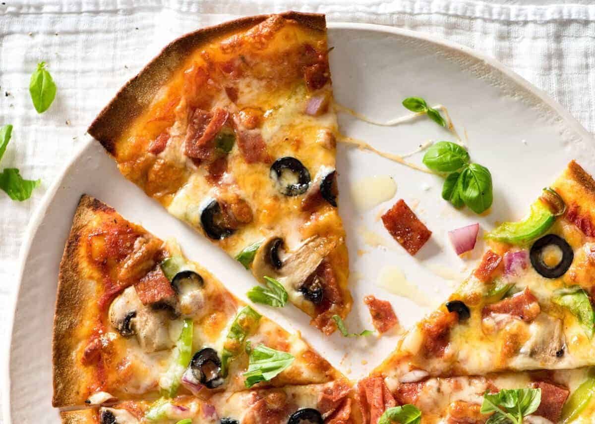 $2 Homemade Frozen Pizzas - quick and easy made using flatbreads, cook from frozen for a terrific Thin & Crispy pizza! dev.recipetineats.com