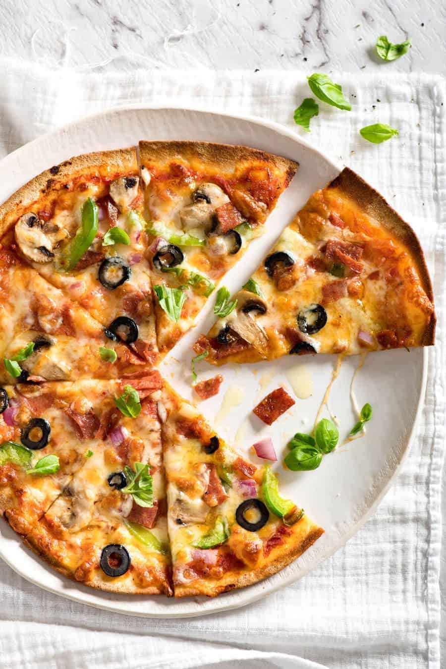 $2 Homemade Frozen Pizzas - quick and easy made using flatbreads, cook from frozen for a terrific Thin & Crispy pizza! dev.recipetineats.com