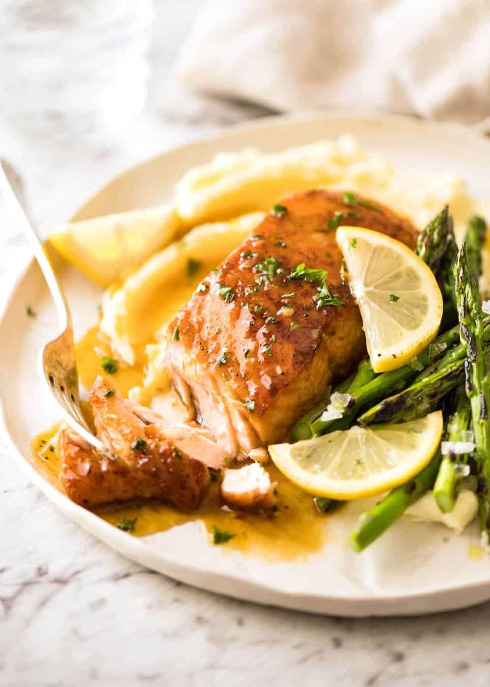 If this Lemon Honey Glazed Salmon takes more than 8 minutes to make, you've overcooked the salmon. That sauce is lip smackingly delicious! dev.recipetineats.com
