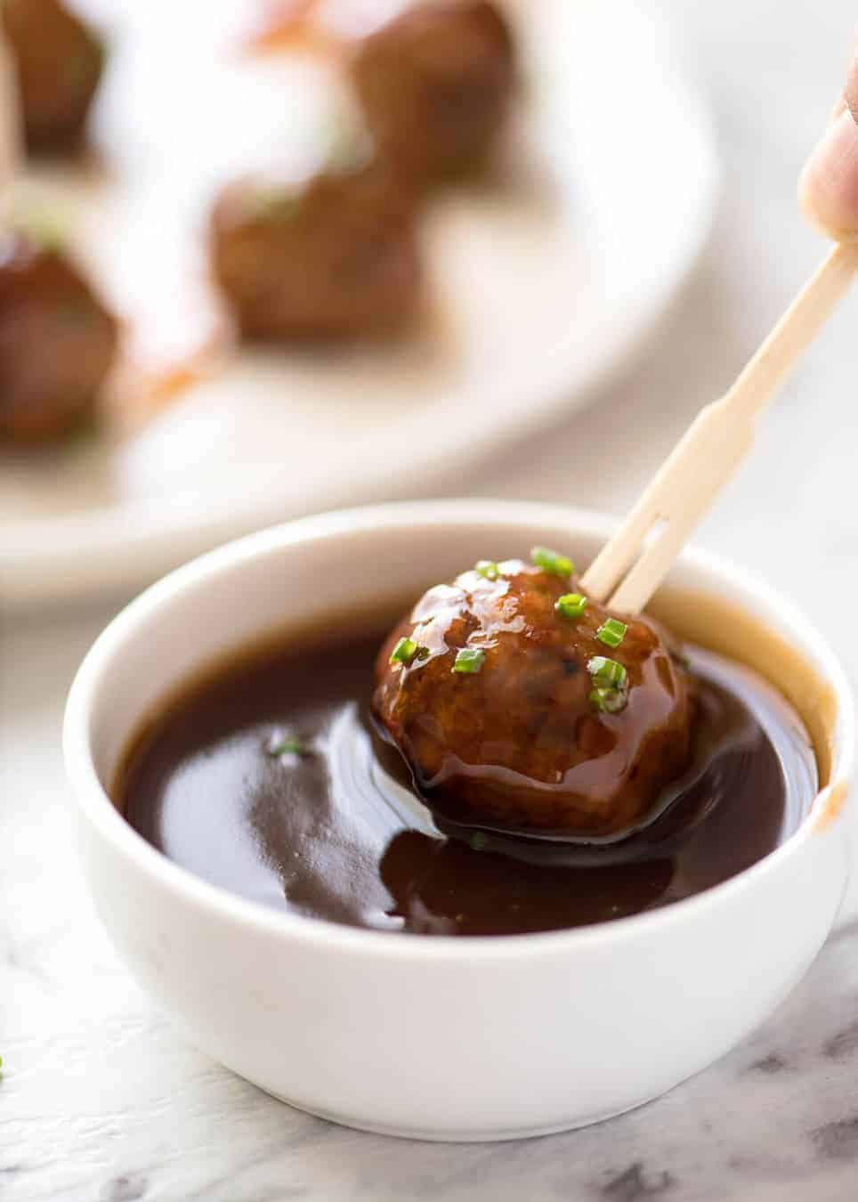 Plump, juicy and soft, these Party Cocktail Meatballs are baked and served with a fabulous Sweet & Sour Dipping Sauce that's super quick to make. Great make ahead for parties! dev.recipetineats.com