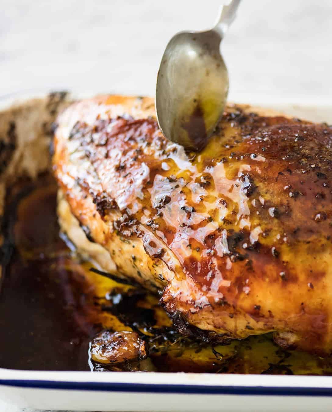 Garlic Herb Butter Roasted Turkey Breast with herb butter under the skin. Quick video tutorial provided. This is food so good, it will make you want to cry! dev.recipetineats.com