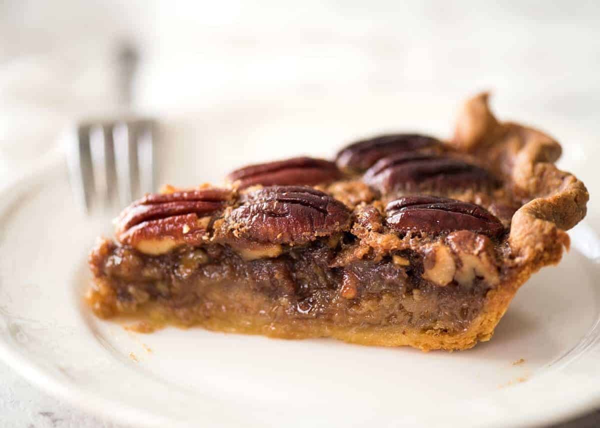 Learn how to make Pecan Pie, the great American classic! Flaky all-butter pie crust with a soft set filling, the quick video tutorial will be very helpful will guide you to nail this every time! dev.recipetineats.com