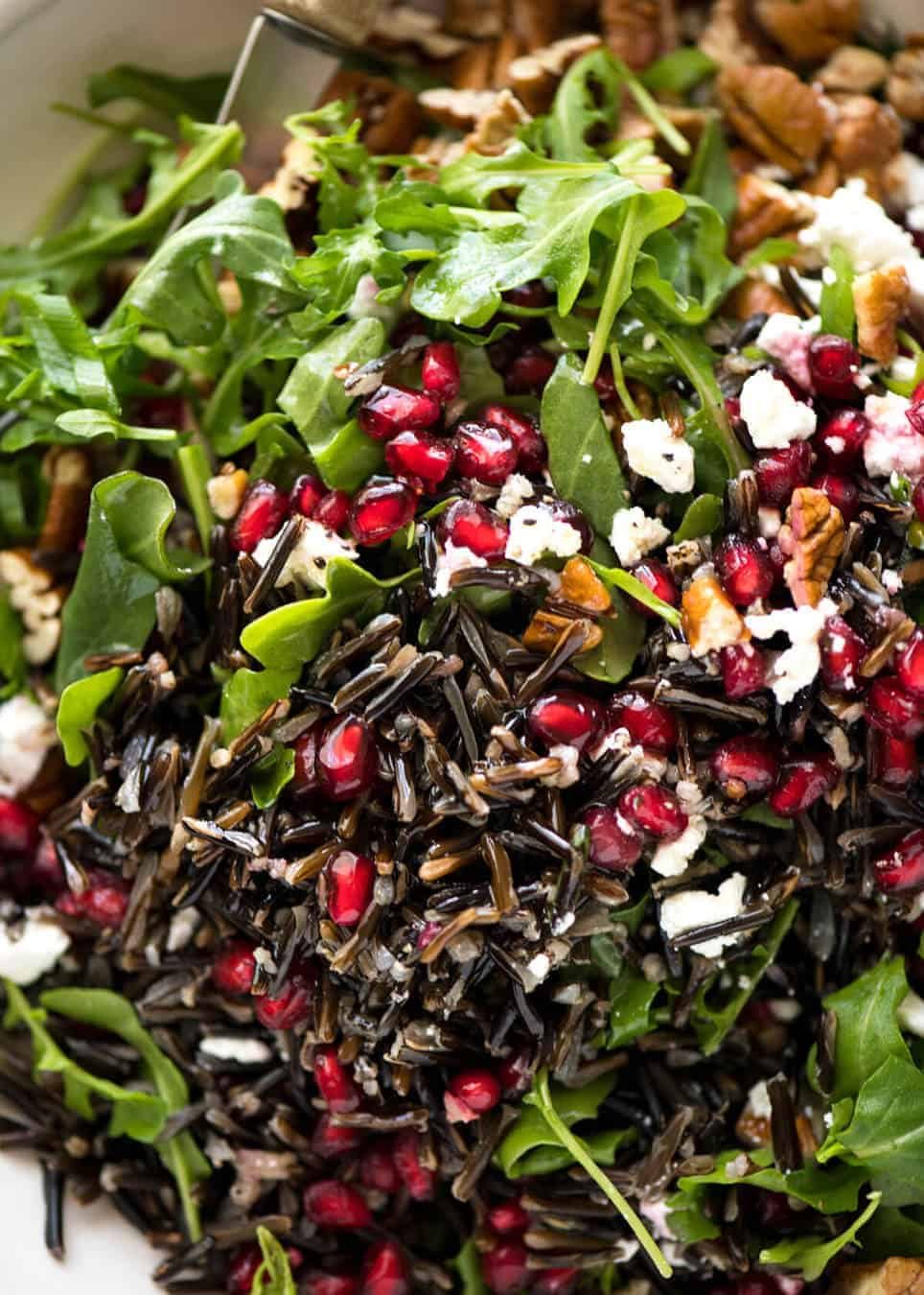 This Wild Rice Salad is a salad for celebrations! Stellar flavour combination - wild rice, pomegranate, pecans, rocket / arugula, green onions, cranberries and feta. dev.recipetineats.com