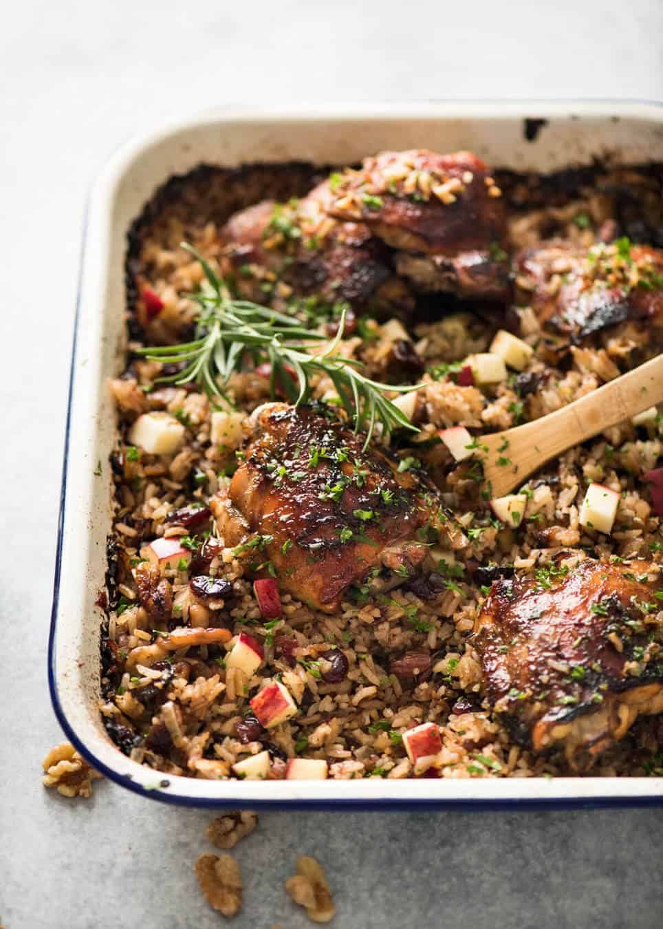 A flavour loaded one-pan, quick midweek dinner - Baked Chicken and Rice Pilaf with Cranberries, Walnuts and Apple. The smell when this is cooking is amazing! dev.recipetineats.com