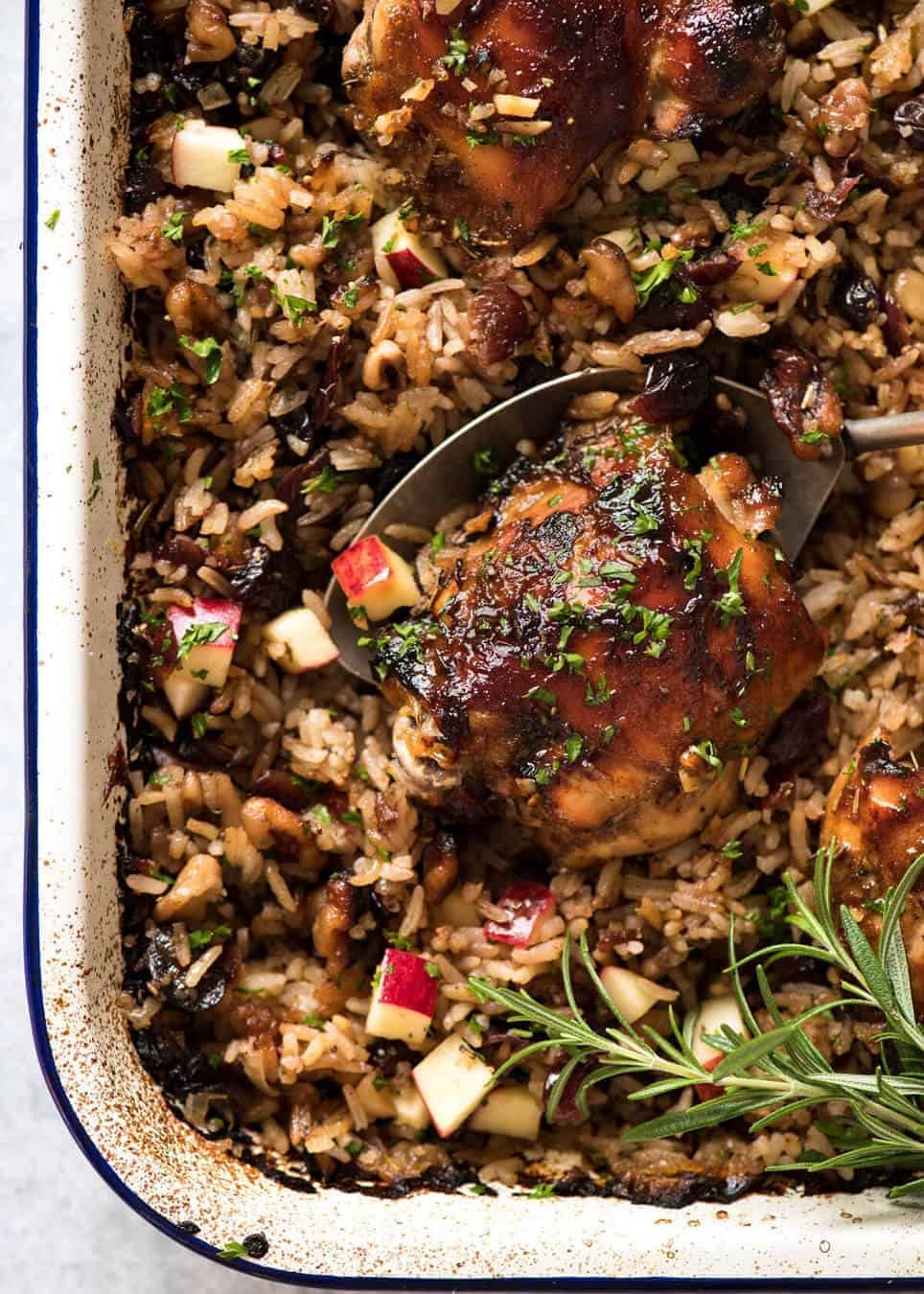 A flavour loaded one-pan, quick midweek dinner - Baked Chicken and Rice Pilaf with Cranberries, Walnuts and Apple. The smell when this is cooking is amazing! dev.recipetineats.com