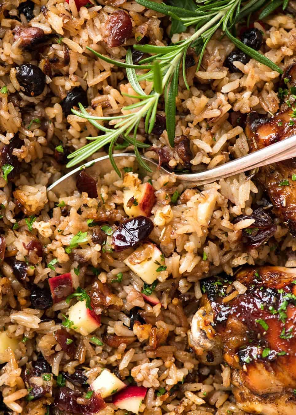 A flavour loaded one-pan, quick midweek dinner - Baked Chicken and Rice Pilaf with Cranberries, Walnuts and Apple. The smell when this is cooking is amazing! dev.recipetineats.com