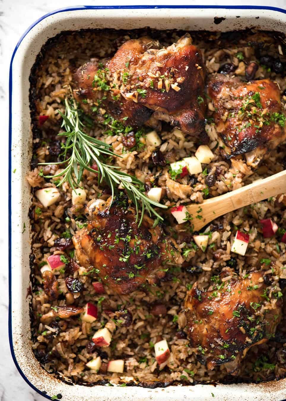 A flavour loaded one-pan, quick midweek dinner - Baked Chicken and Rice Pilaf with Cranberries, Walnuts and Apple. The smell when this is cooking is amazing! dev.recipetineats.com