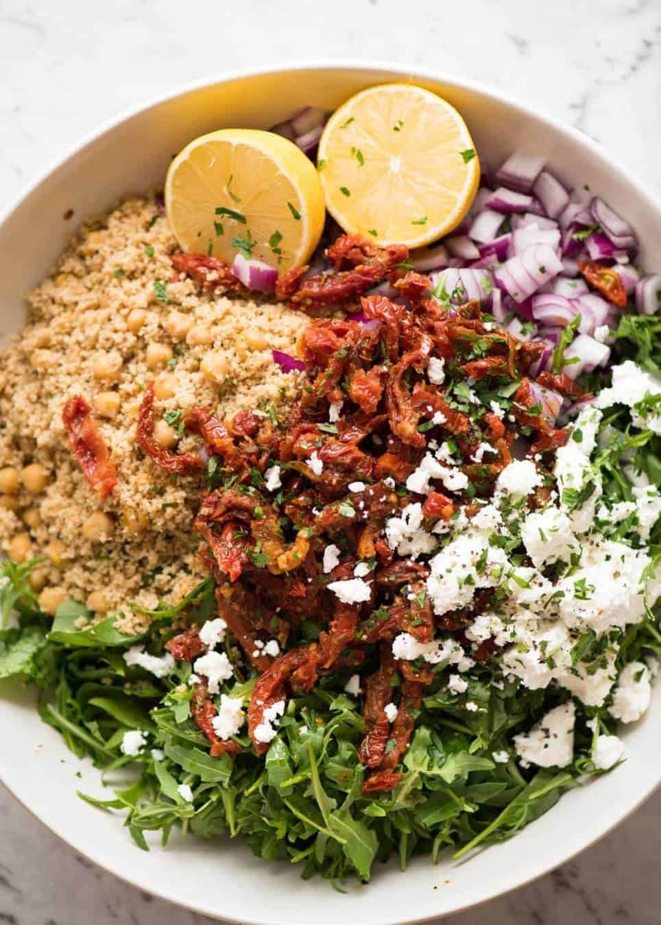 The best 12 minute salad in the world: Couscous Salad with Sun Dried Tomatoes and Feta dev.recipetineats.com