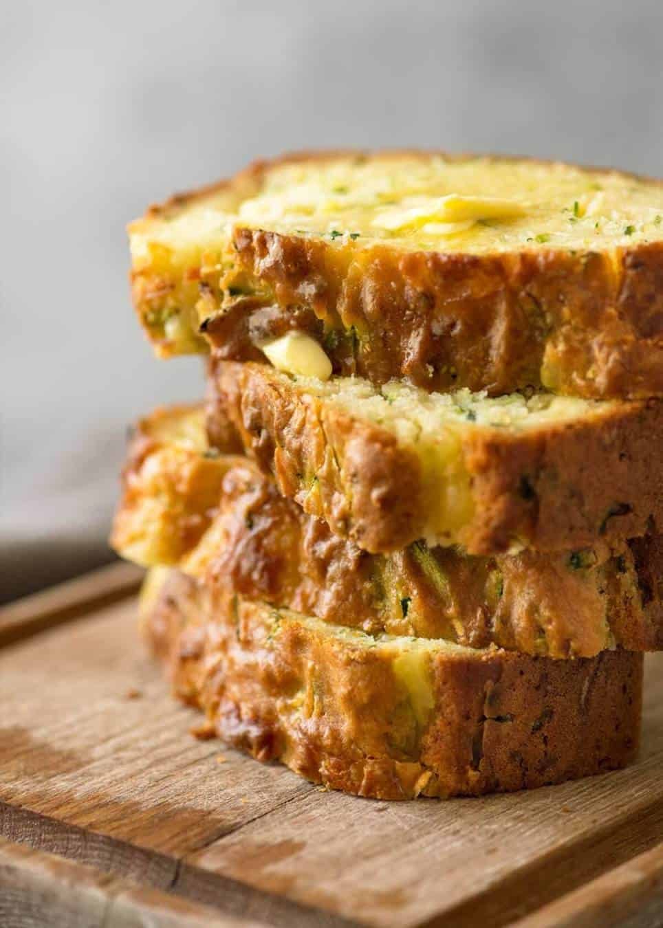 A Cheesy Zucchini Bread that's quick to make (no yeast) and is so moist, you'll scoff it down even without slathering it with butter! dev.recipetineats.com