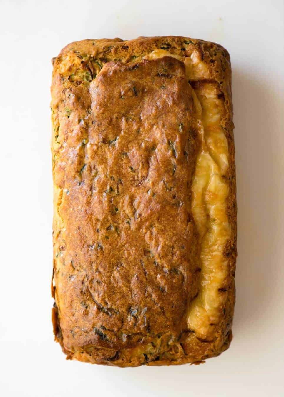 A Cheesy Zucchini Bread that's quick to make (no yeast) and is so moist, you'll scoff it down even without slathering it with butter! dev.recipetineats.com