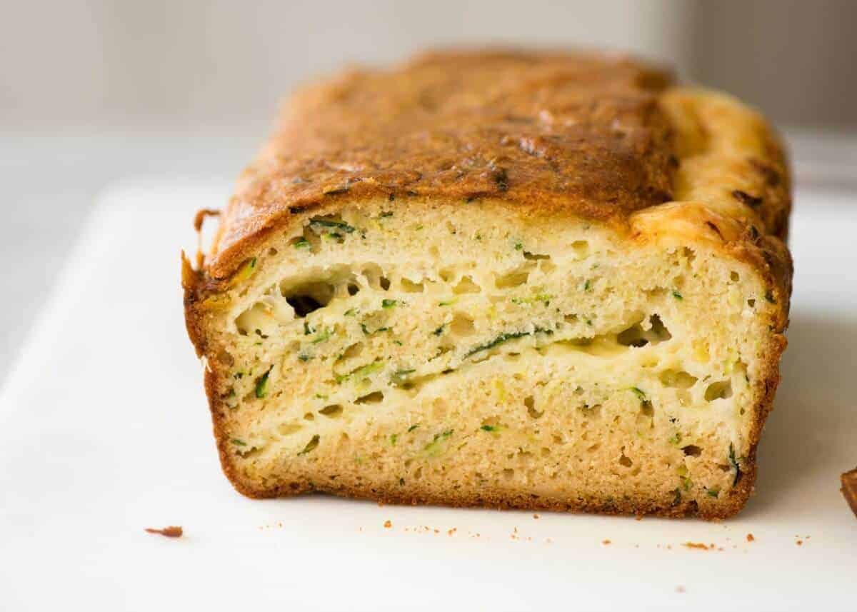 A Cheesy Zucchini Bread that's quick to make (no yeast) and is so moist, you'll scoff it down even without slathering it with butter! dev.recipetineats.com