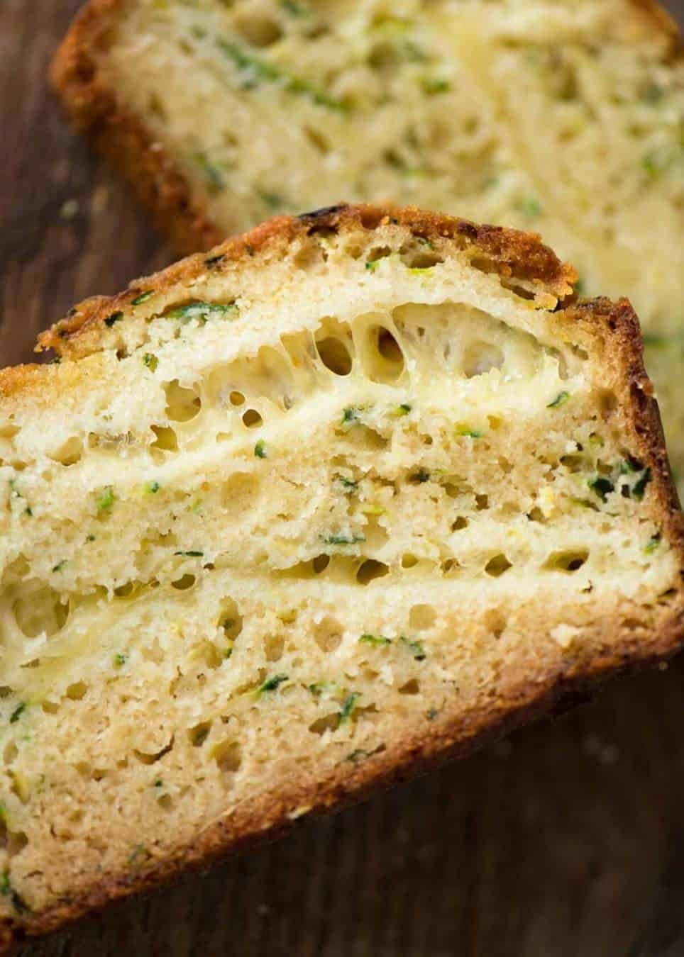 A Cheesy Zucchini Bread that's quick to make (no yeast) and is so moist, you'll scoff it down even without slathering it with butter! dev.recipetineats.com