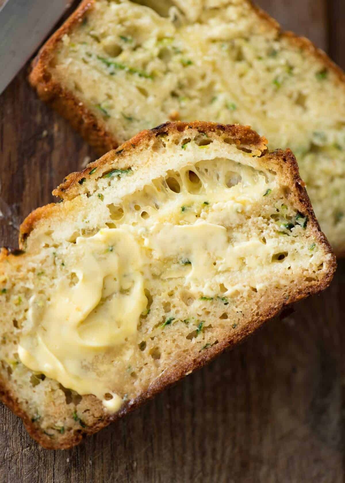A Cheesy Zucchini Bread that's quick to make (no yeast) and is so moist, you'll scoff it down even without slathering it with butter! dev.recipetineats.com