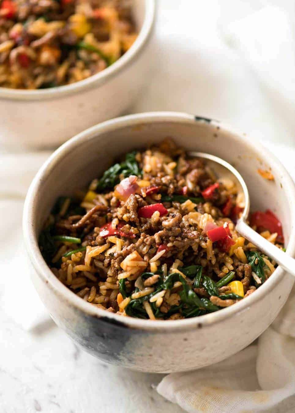 A quick, fabulous midweek meal - this ground Beef and Rice is made by browning ground beef, then cooking it with flavoured rice and loads of veggies. Irresistibly delicious! dev.recipetineats.com