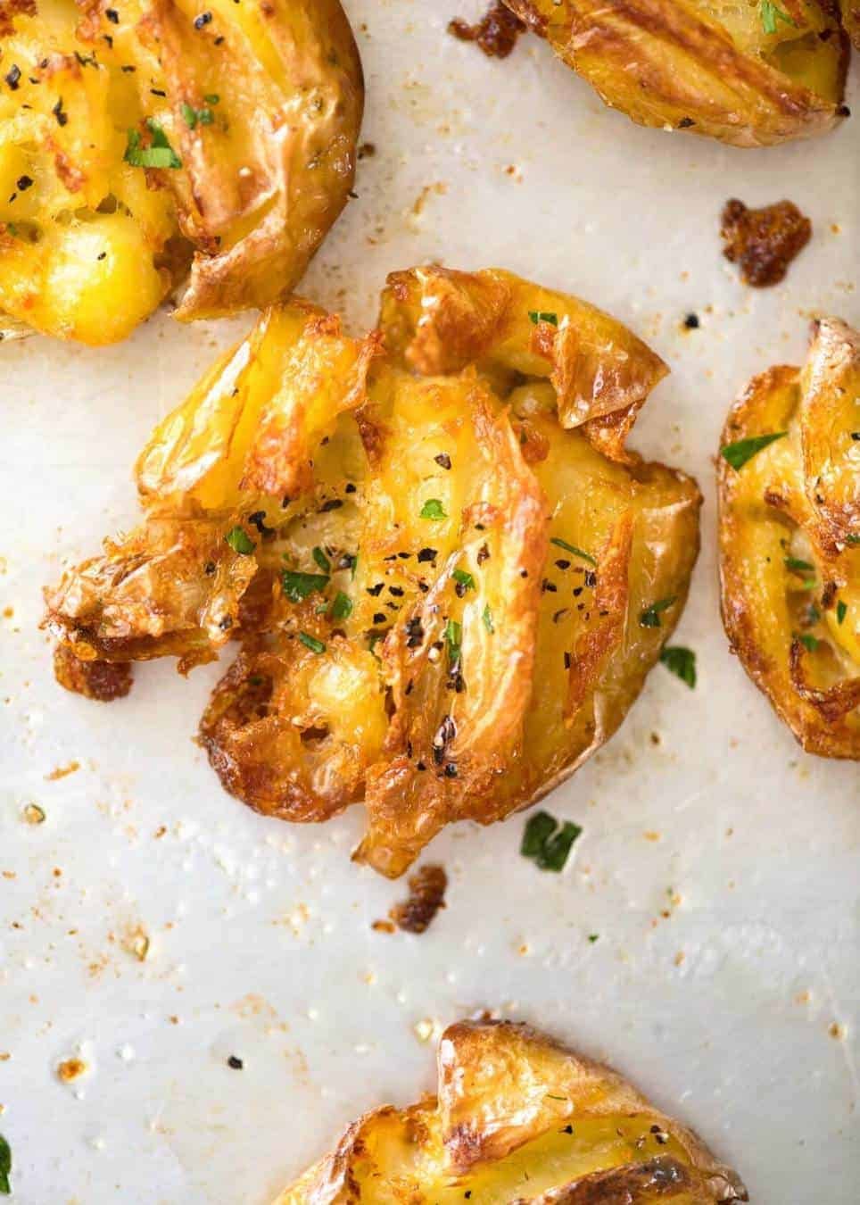 The best, buttery, golden, ultra crispy smashed potatoes you will ever have! dev.recipetineats.com