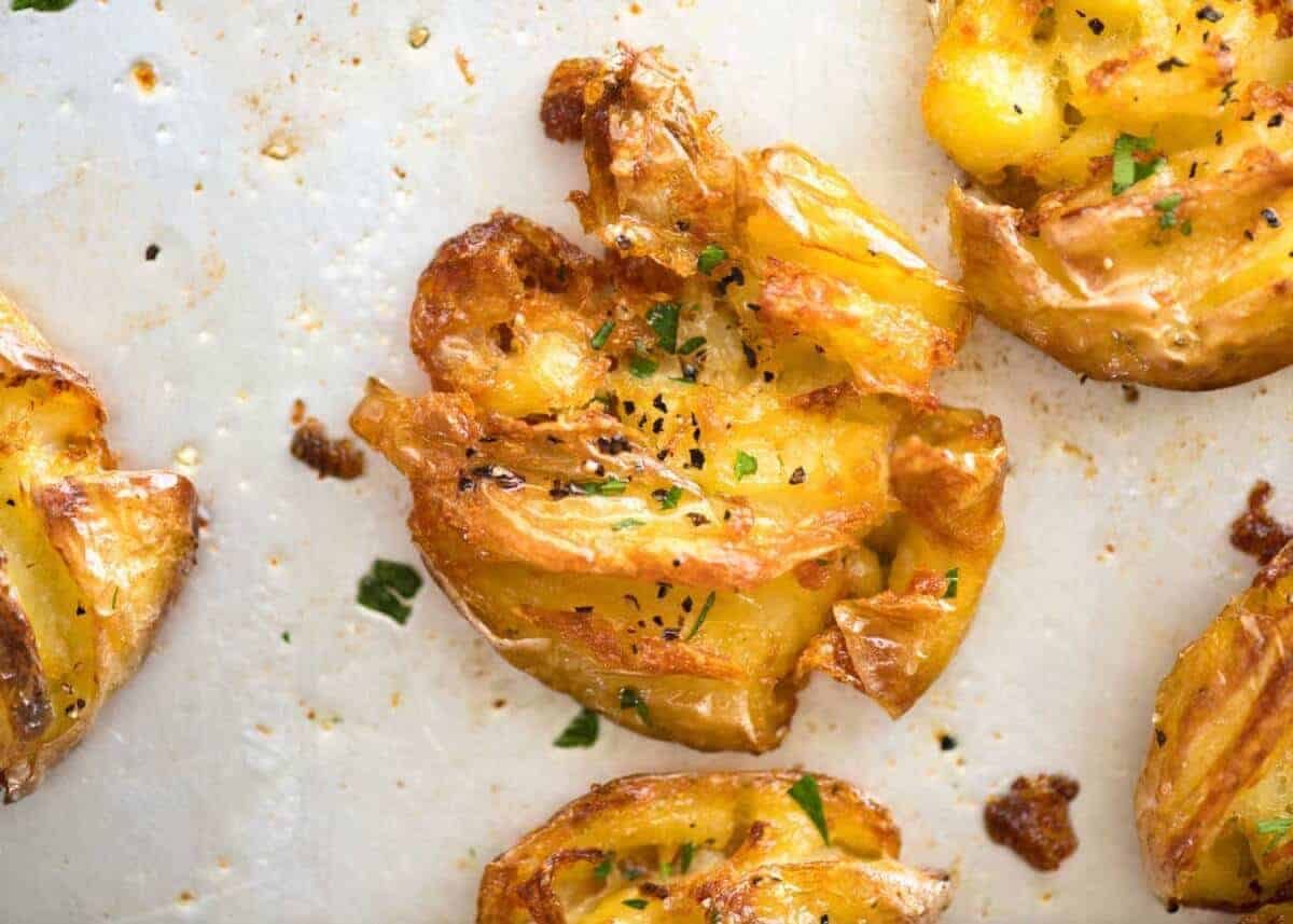 The best, buttery, golden, ultra crispy smashed potatoes you will ever have! dev.recipetineats.com