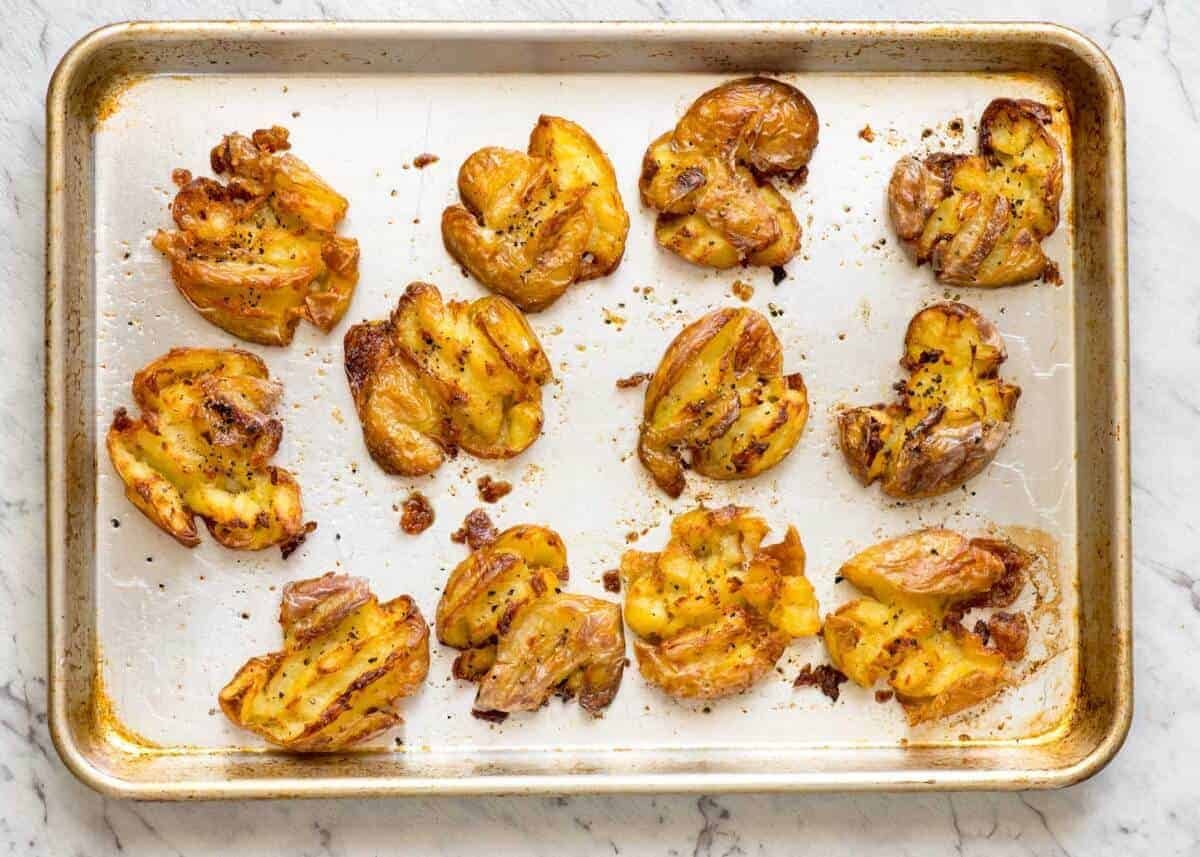 The best, buttery, golden, ultra crispy smashed potatoes you will ever have! dev.recipetineats.com