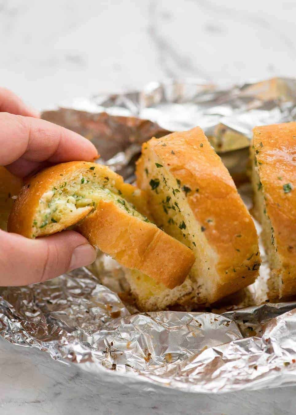 Better than Pizza Hut! For a truly religious Garlic Bread experience, skip the artisan bread and use a basic French stick. And no skimping on butter! dev.recipetineats.com