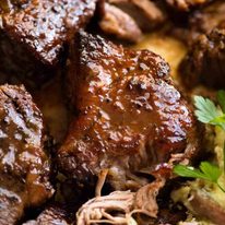 Close up of Brown Sugar Garlic Butter Roast Pork, ultra tender, ready to be served