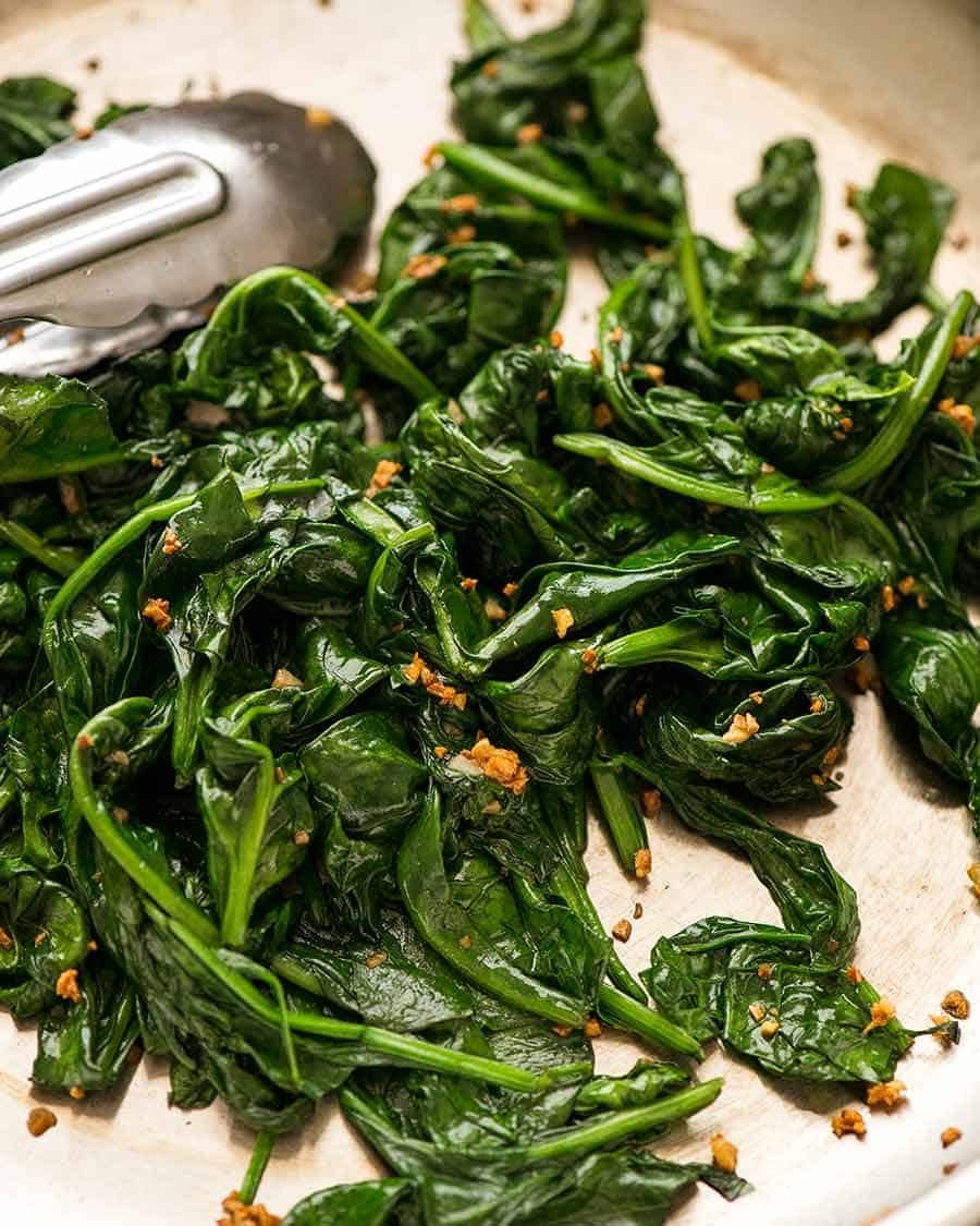 Garlic Saut&eacute;ed Spinach in a skillet, ready to be served