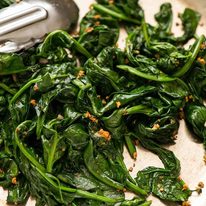 Garlic Saut&eacute;ed Spinach in a skillet, ready to be served