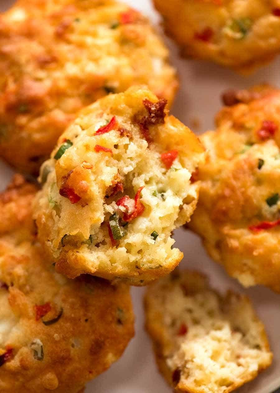 Close up showing the inside of Mediterranea Savoury Muffins - cheesy muffins with olives, sun dried tomatoes, roasted peppers, feta and cheese
