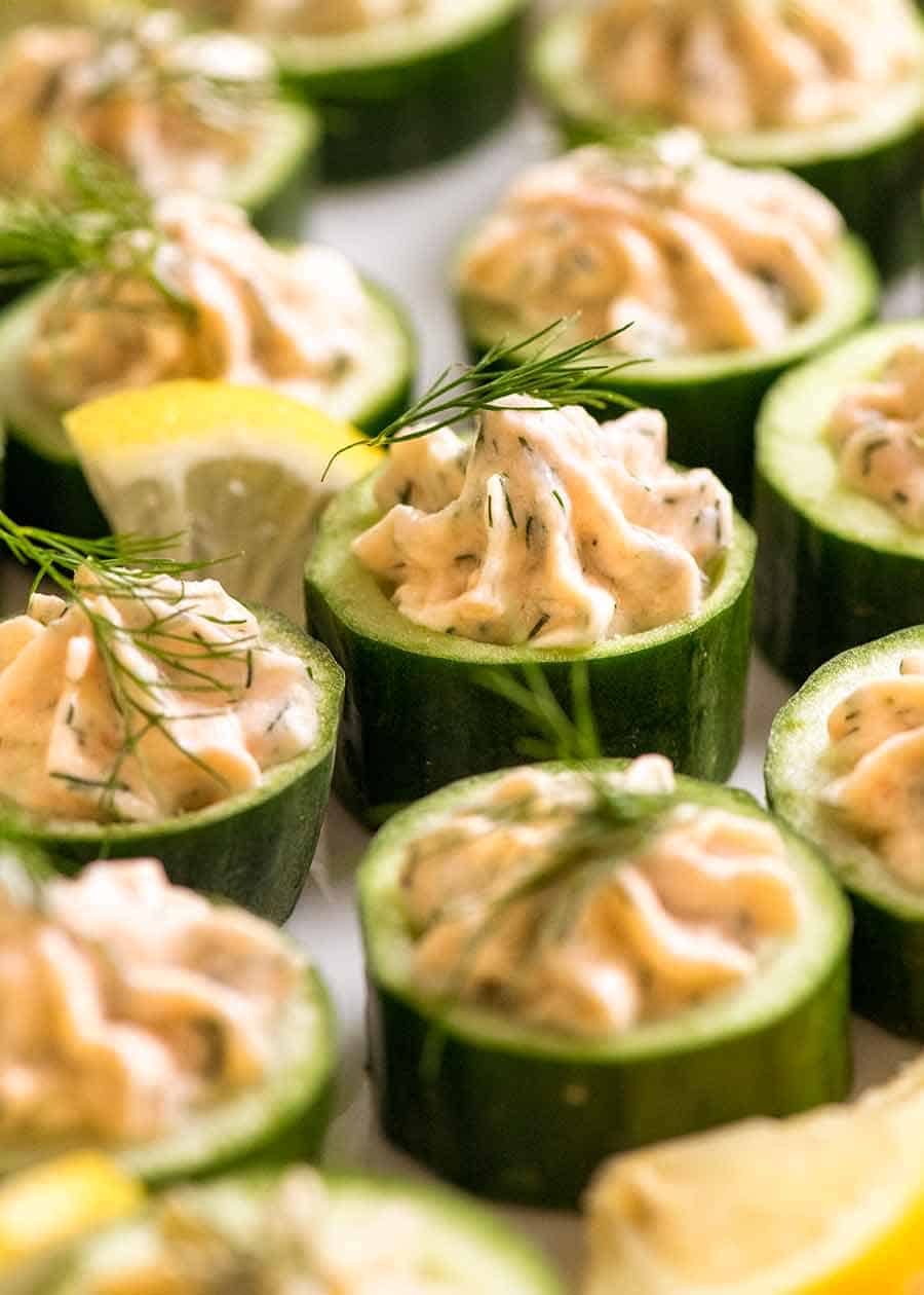 Close up of Cucumber Canap&eacute;s topped with smoked salmon mousse garnished with dill