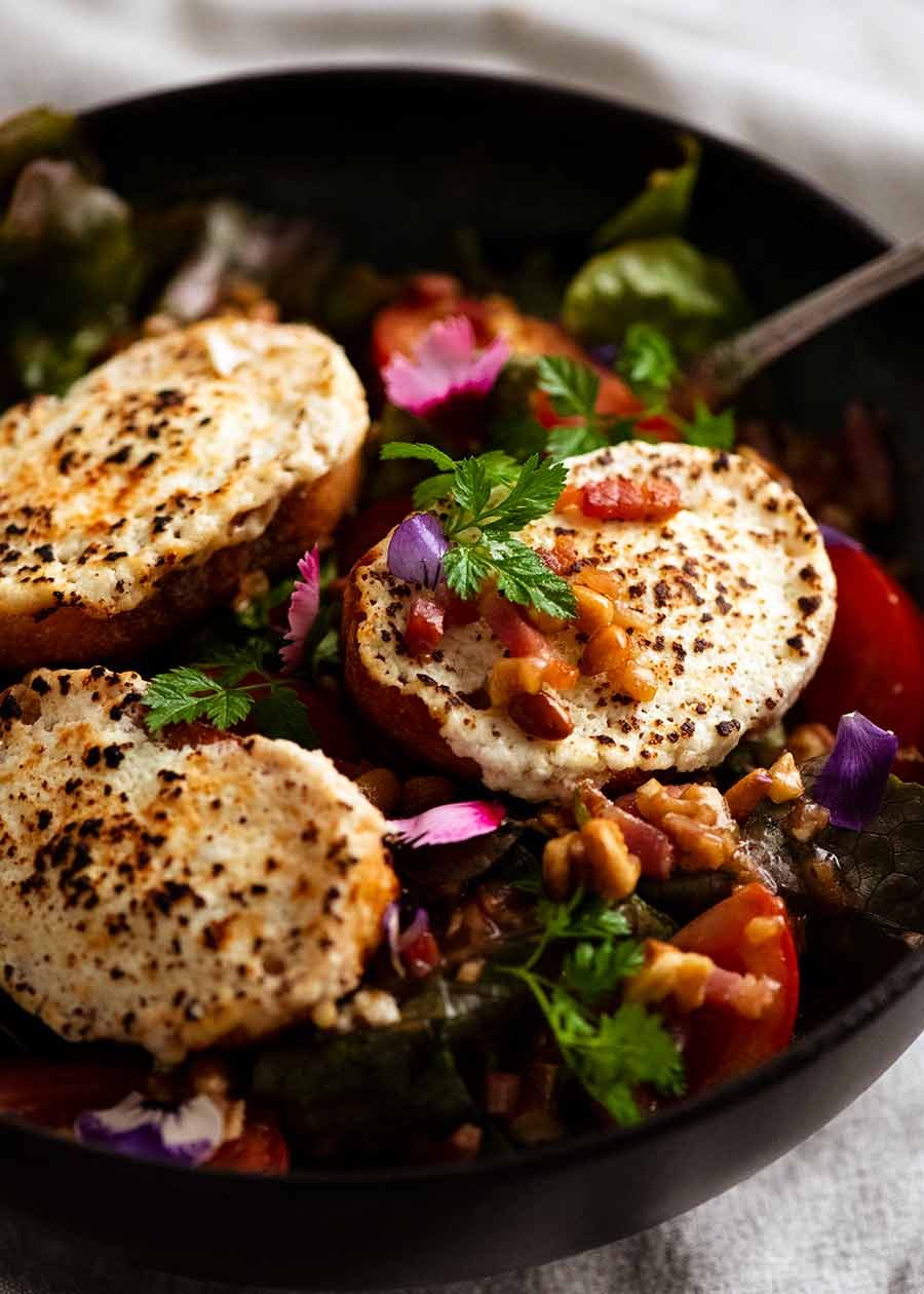 Warm French Goat's Cheese Salad (Salade de Ch&ecirc;vre Chaud) in a bowl, ready to be eaten