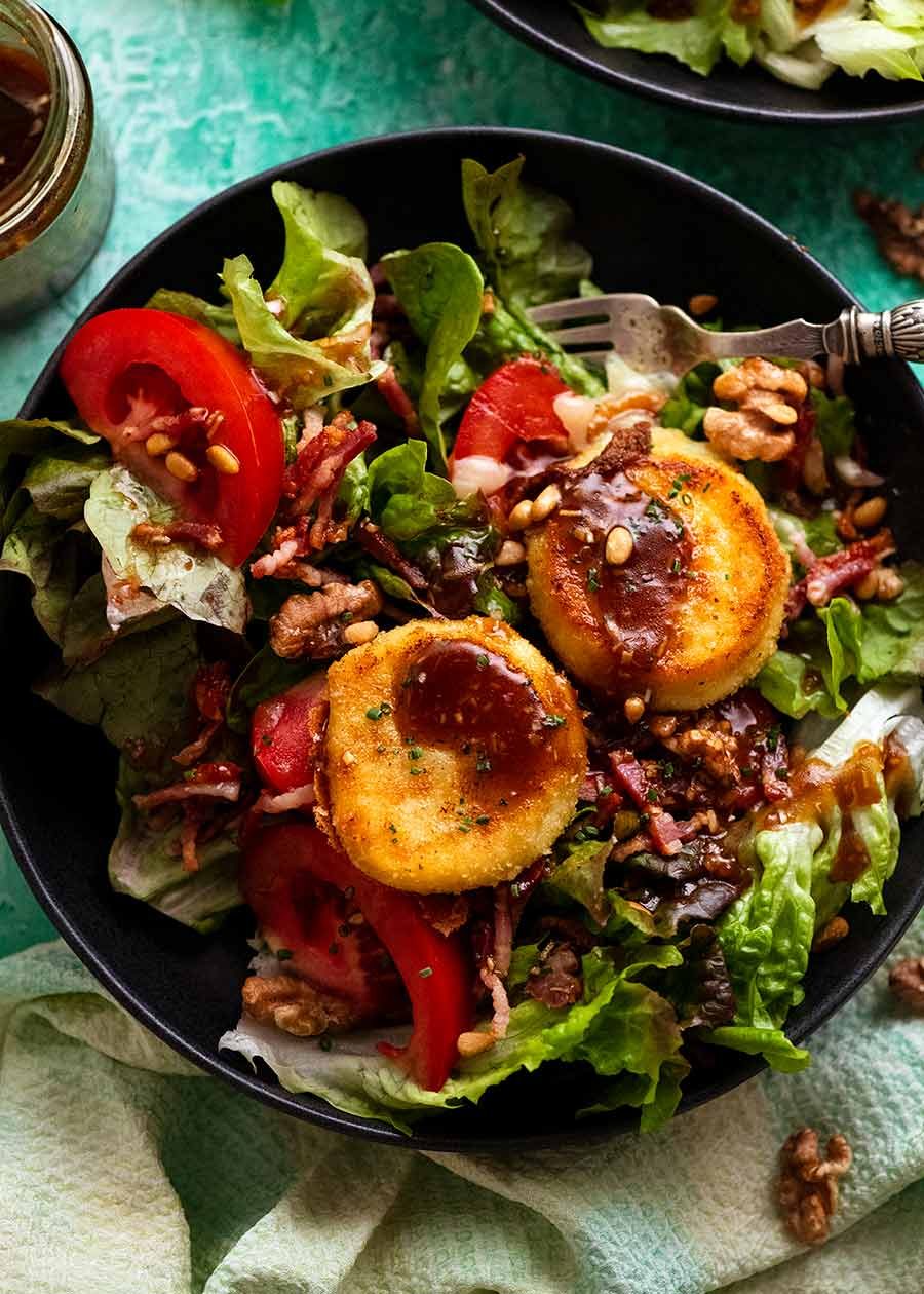 Overhead photo of Close up chowing melting inside of French Goats Cheese on Warm French Goat's Cheese Salad (Salade de Ch&ecirc;vre Chaud)