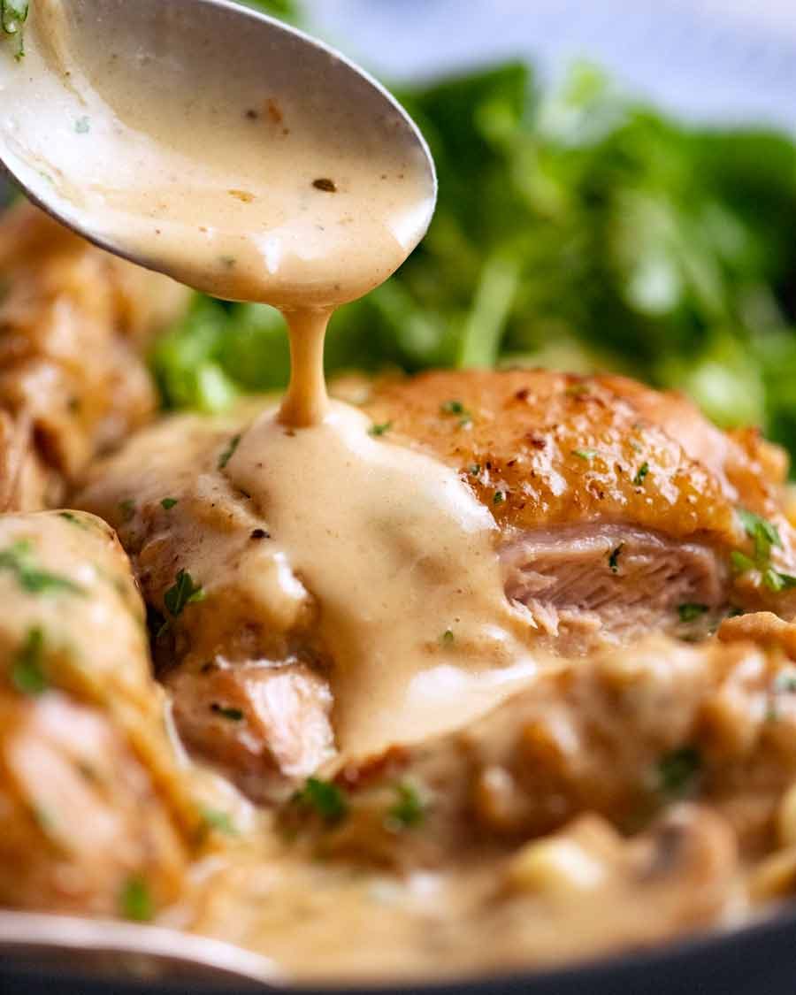 Drizzling Chicken Fricass&eacute;e sauce over chicken