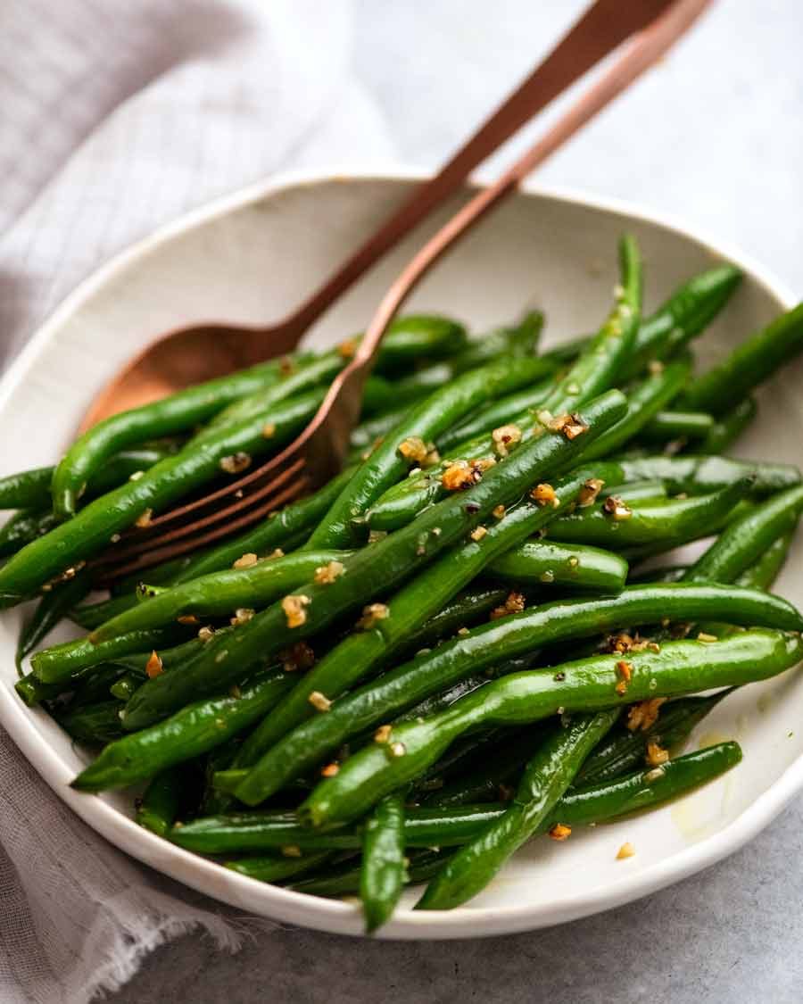 Garlic Saut&eacute;ed Green Beans on a plate ready to be served