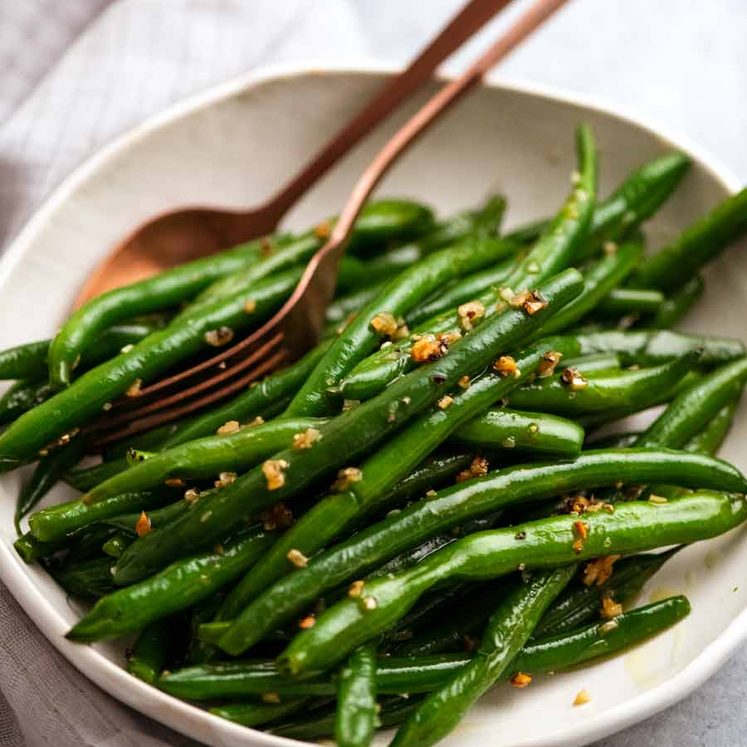 Garlic Saut&eacute;ed Green Beans on a plate ready to be served