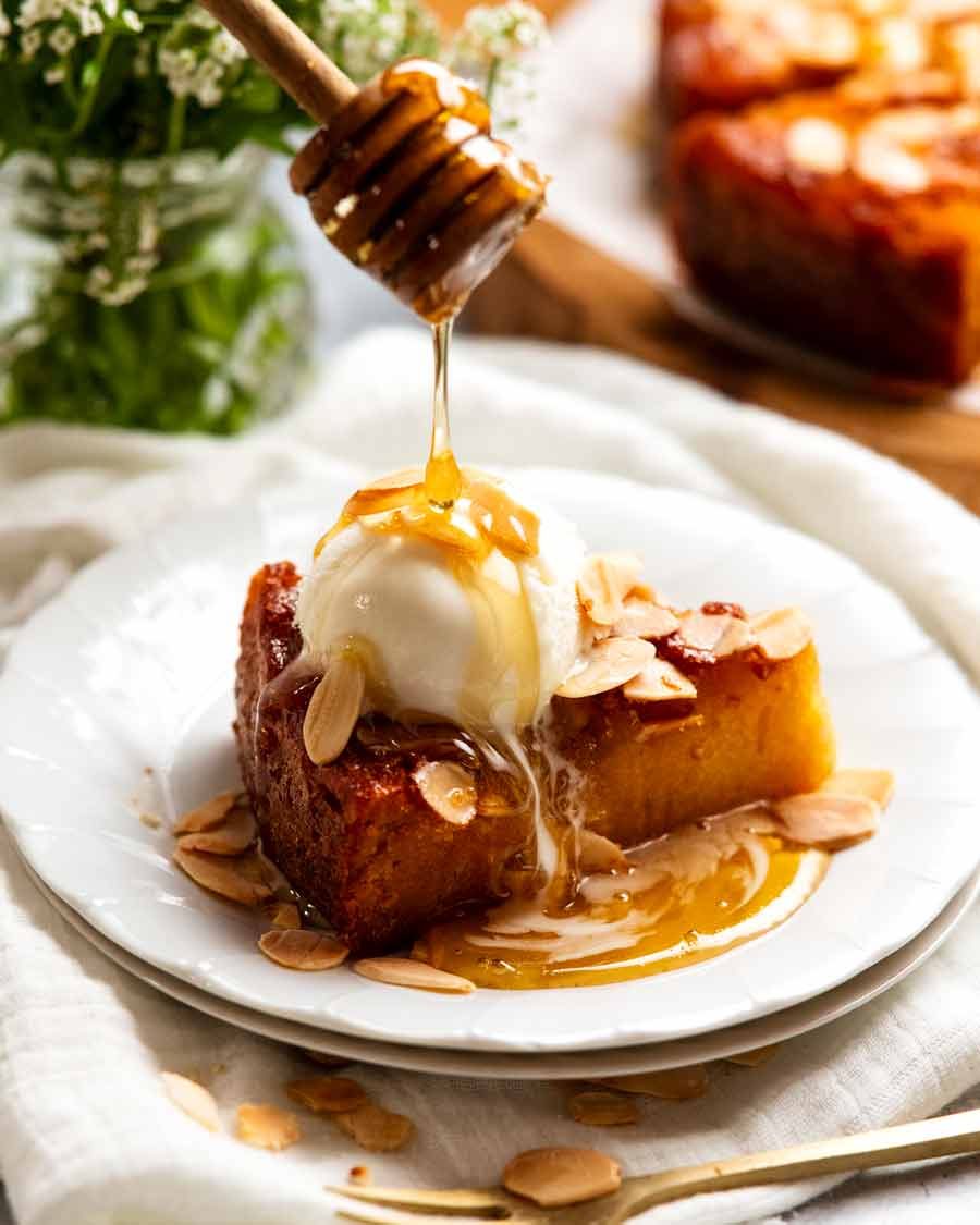 Slice of honey cake with vanilla ice cream